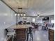 Open floor plan view shows kitchen, dining, living room spaces, and wood plank ceilings at 912 Sweetbriar Ave, Whiteland, IN 46184
