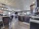 Open-concept living space features a kitchen with stainless appliances and a cozy living area with comfortable seating at 912 Sweetbriar Ave, Whiteland, IN 46184