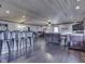 Open-concept living space features a wood plank ceiling, recessed lights, and hardwood floors at 912 Sweetbriar Ave, Whiteland, IN 46184
