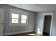 Bright bedroom featuring a large window and a doorway, ready for personalization and decor at 951 N Tuxedo St, Indianapolis, IN 46201