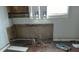 Kitchen renovation project with exposed plumbing, ready for new appliances and custom design at 951 N Tuxedo St, Indianapolis, IN 46201