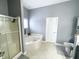 Bright bathroom features a corner tub, shower, and toilet with modern fixtures at 9978 Niagara Dr, Fishers, IN 46037