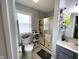 This well-lit bathroom features a vanity, toilet, and glass enclosed shower with coordinated decor at 9978 Niagara Dr, Fishers, IN 46037