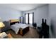 Neutral bedroom with ample natural light, with a wooden accent headboard and chest at 9978 Niagara Dr, Fishers, IN 46037