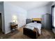Neutral bedroom with ample natural light, with a wooden accent headboard and chest at 9978 Niagara Dr, Fishers, IN 46037