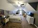 This spacious bedroom with vaulted ceilings includes a double bed, desk area, and television at 9978 Niagara Dr, Fishers, IN 46037