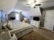 This spacious bedroom with vaulted ceilings includes a double bed, desk area, and television at 9978 Niagara Dr, Fishers, IN 46037
