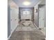 Inviting foyer featuring tile flooring and grand entrance doors at 9978 Niagara Dr, Fishers, IN 46037