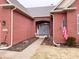 Charming brick home featuring an arched entrance, double doors, and American flag at 9978 Niagara Dr, Fishers, IN 46037