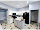 Bright kitchen with white cabinetry, center island, and modern appliances at 9978 Niagara Dr, Fishers, IN 46037