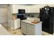 Modern kitchen featuring white cabinets, stainless steel appliances, and center island at 9978 Niagara Dr, Fishers, IN 46037