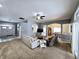 Spacious open-concept living room with neutral walls, carpet, and abundant natural light at 9978 Niagara Dr, Fishers, IN 46037