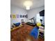Finished room setup as an exercise room with hardwood floors and a treadmill at 9978 Niagara Dr, Fishers, IN 46037