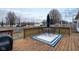 Back deck includes a table, chairs, umbrella and grill overlooking a fenced-in yard at 10154 Holly Berry Cir, Fishers, IN 46038