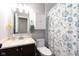 Neat bathroom with a sink and a shower with an inviting floral curtain at 10154 Holly Berry Cir, Fishers, IN 46038