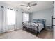 Inviting bedroom with elegant metal bed frame and serene, naturally-lit atmosphere at 10154 Holly Berry Cir, Fishers, IN 46038