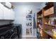 Well-organized laundry room with modern washer and dryer, shelving, and ample storage at 10154 Holly Berry Cir, Fishers, IN 46038