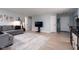 Open-concept living room with light hardwood floors, neutral walls, and comfortable furnishings at 10154 Holly Berry Cir, Fishers, IN 46038