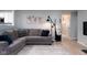 Cozy living room featuring a comfortable sectional sofa and stylish decor at 10154 Holly Berry Cir, Fishers, IN 46038