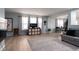 Bright living room showcasing hardwood floors, ample natural light, and neutral wall colors at 10154 Holly Berry Cir, Fishers, IN 46038