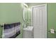 Compact bathroom features a vanity sink and a modern mirror, designed for convenience at 103 S Delawanda Ave, Muncie, IN 47303