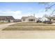 Exterior view of home with beige siding and tidy lawn in a residential neighborhood at 103 S Delawanda Ave, Muncie, IN 47303