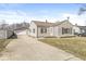 Charming home with an detached garage, long driveway, and manicured lawn at 103 S Delawanda Ave, Muncie, IN 47303