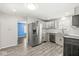 Well-lit kitchen with stainless steel appliances and white subway tile backsplash, a perfect space for culinary creativity at 103 S Delawanda Ave, Muncie, IN 47303