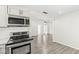Well-equipped kitchen with stainless steel appliances and ample counter space, ideal for cooking and dining at 103 S Delawanda Ave, Muncie, IN 47303