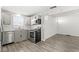 Modern kitchen features stainless steel appliances, including a dishwasher, for easy meal preparation and cleanup at 103 S Delawanda Ave, Muncie, IN 47303