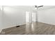 Bright living room with sleek wood-look floors and a ceiling fan, ready for relaxation and entertaining at 103 S Delawanda Ave, Muncie, IN 47303