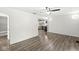 Bright living room featuring stylish flooring, a ceiling fan, and neutral walls at 103 S Delawanda Ave, Muncie, IN 47303