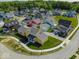 An aerial view shows this neighborhood has colorful houses and well-manicured lawns at 10483 St Anne Dr, Zionsville, IN 46077