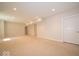 Large finished basement with plush carpeting, recessed lighting, and a neutral color palette at 10483 St Anne Dr, Zionsville, IN 46077