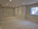 Spacious unfinished basement with neutral carpet and recessed lighting, offering versatile potential at 10483 St Anne Dr, Zionsville, IN 46077