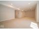 Spacious finished basement with plush carpeting, neutral walls, and recessed lighting at 10483 St Anne Dr, Zionsville, IN 46077