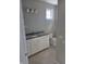 Well-lit bathroom featuring a granite countertop, white cabinets, and modern fixtures at 10483 St Anne Dr, Zionsville, IN 46077