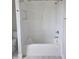 Modern bathtub with tiled walls and a shower niche at 10483 St Anne Dr, Zionsville, IN 46077