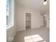 Bright bedroom featuring neutral walls, plush carpeting and an open closet at 10483 St Anne Dr, Zionsville, IN 46077