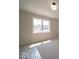 Bright bedroom with a large window providing ample natural light and a view of the outdoors at 10483 St Anne Dr, Zionsville, IN 46077
