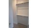 Walk-in closet with two metal rails, featuring ample space for clothing storage, showcasing the home's organization options at 10483 St Anne Dr, Zionsville, IN 46077