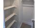 A closet with multiple shelves and a metal rail, designed for efficient storage and organization of belongings at 10483 St Anne Dr, Zionsville, IN 46077