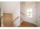 Bright entryway with hardwood floors and staircase at 10483 St Anne Dr, Zionsville, IN 46077