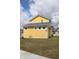 Charming two-story home with yellow siding, a grey roof, and a well-maintained green lawn at 10483 St Anne Dr, Zionsville, IN 46077