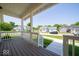 Cozy covered porch with wooden floors, white railing, and a view of the neighborhood at 10483 St Anne Dr, Zionsville, IN 46077