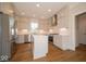 Modern kitchen with stainless steel appliances and a kitchen island at 10483 St Anne Dr, Zionsville, IN 46077