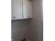 Clean laundry room with white cabinets and ample storage space, showcasing functionality and a neutral color scheme at 10483 St Anne Dr, Zionsville, IN 46077