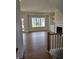 Inviting living room with hardwood floors, a fireplace, built-ins, and a large window with natural light at 10483 St Anne Dr, Zionsville, IN 46077