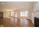 Sunlit living room with hardwood floors and large windows at 10483 St Anne Dr, Zionsville, IN 46077