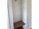 Practical mudroom area with a wooden bench, coat hooks, and white paneled walls at 10483 St Anne Dr, Zionsville, IN 46077